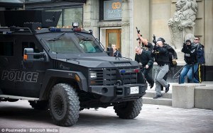 Guns raised- Emergency responders escort VIPs out of building on Sparks Street near the Post Office - http://www.dailymail.co.uk