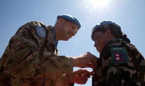 Major-General Luciano Portolano, UNIFIL Force Commander and Head of Mission awards United Nations peace medal to Nepalese peacekeeper