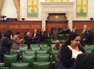 People inside the Conservative Party caucus room blocked the door with a stack of chairs - http://www.dailymail.co.uk